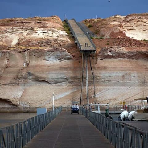 Historically low water levels in Lake Powell and Lake Mead threaten water and power for millions